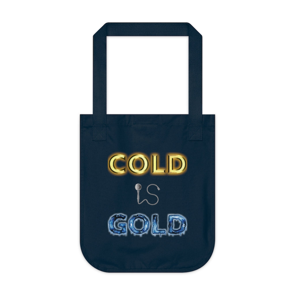 GOLD IS COLD - Navy organic canvas tote bag with our classic Cold is Gold design but with the effects reversed. The word cold is golden like bullion while the word gold is frozen stiff with icicles. The word Is is still represented by a shower head and hose. Designed by Mark Buckwell for Sir Real Digital.